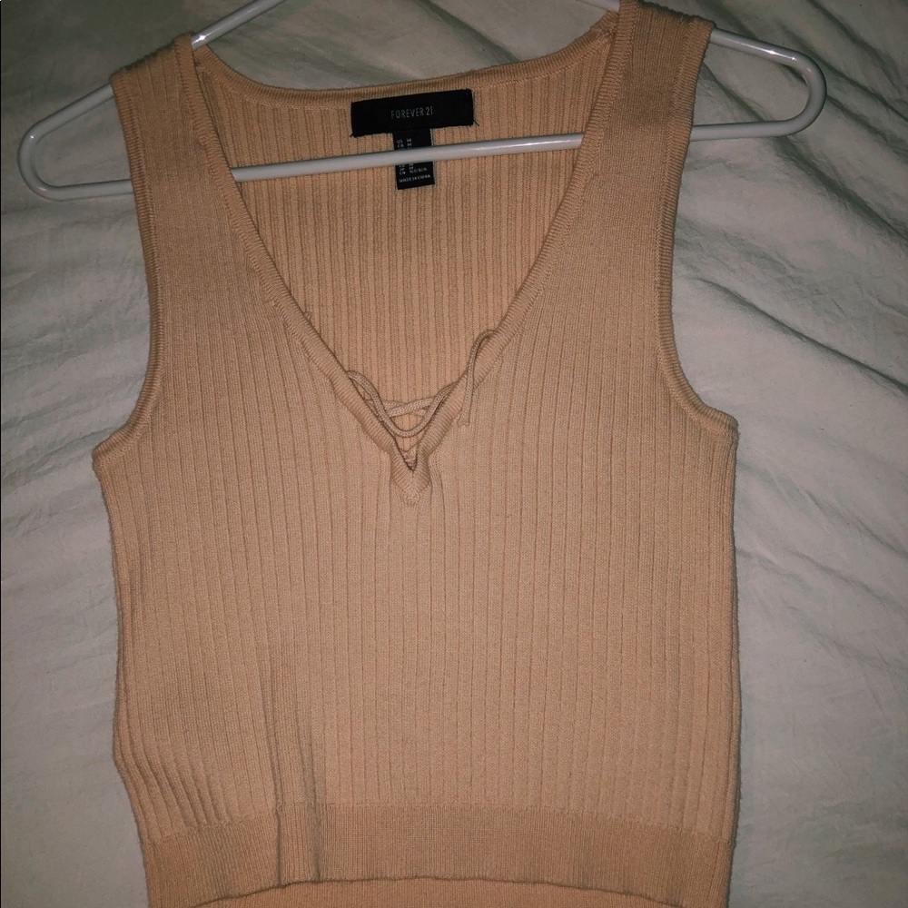 Sweater material top, cropped, and cream color.
